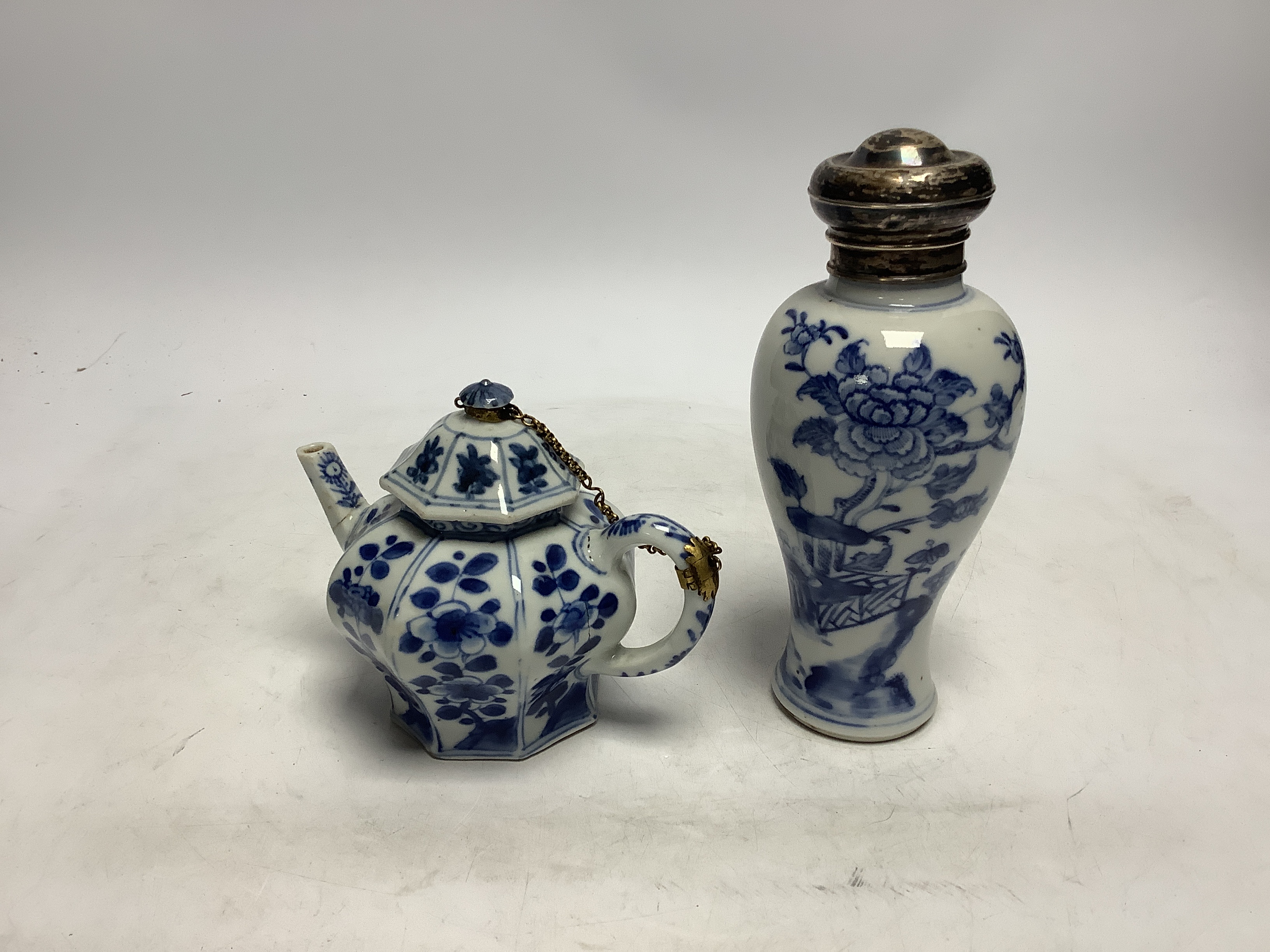 A Chinese blue and white octagonal teapot and cover with gilt metal mounts and a blue and white baluster vase, 16.5cm high, both 18th century